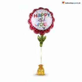 Palloncino di compleanno con fiore e pois rosa di buon compleanno