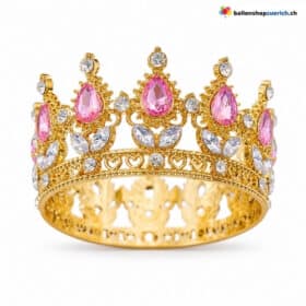 Pequeña corona dorada en color rosa con piedras preciosas.